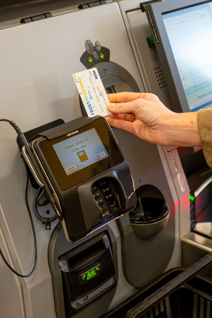 Swiping a Frost card in a card reader