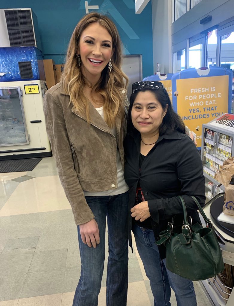 Keli standing with woman she bought groceries for.